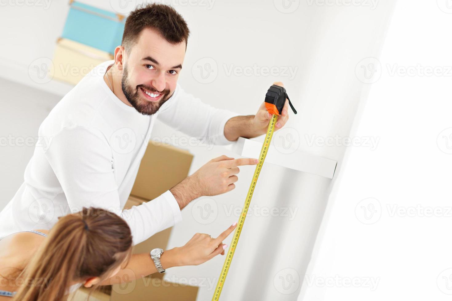 Happy adult couple moving out or in to new home photo