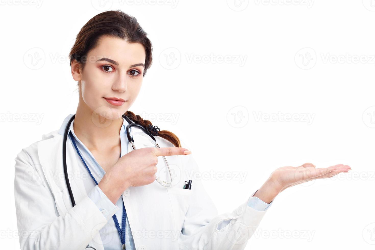 Woman doctor isolated over white background photo