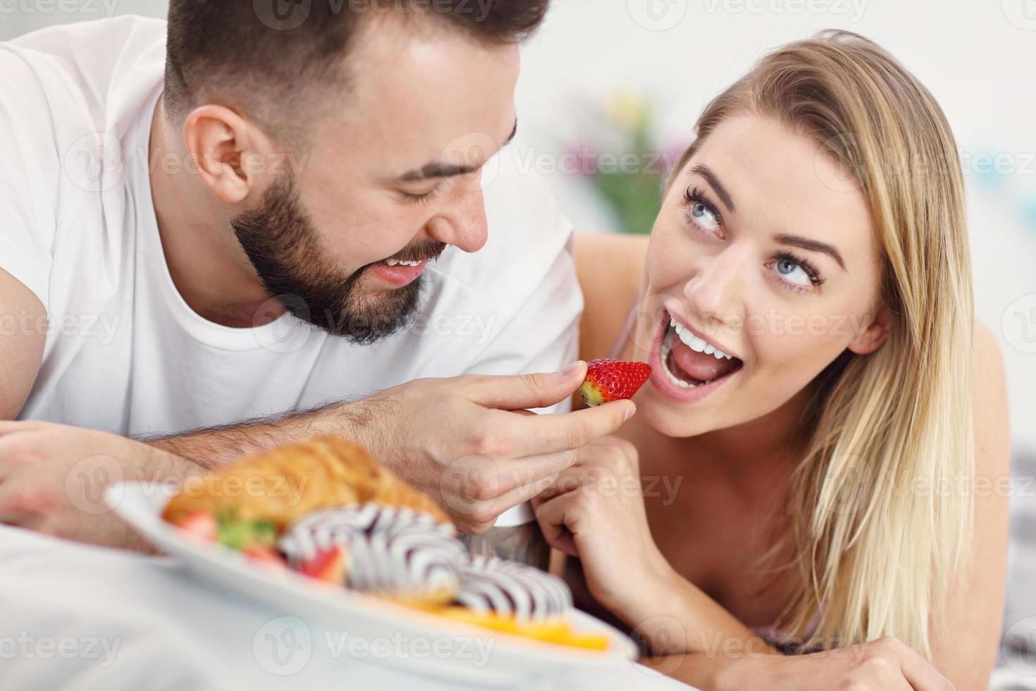 Adult attractive couple in bed photo