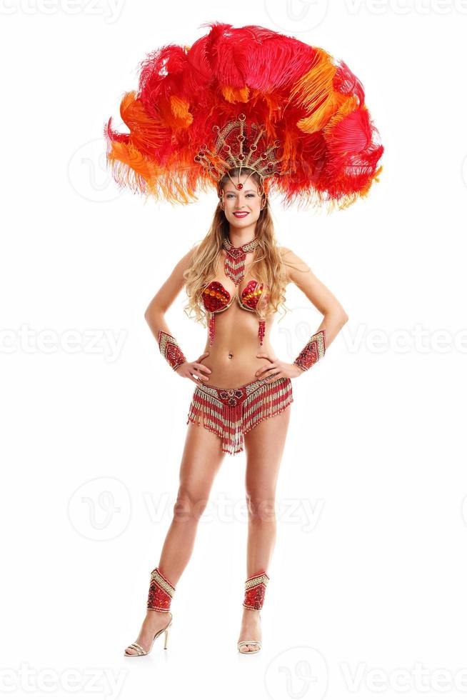 Brazilian woman posing in samba costume over white background photo