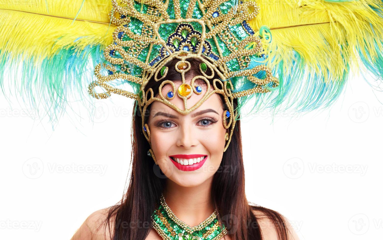 Brazilian woman posing in samba costume over white background photo