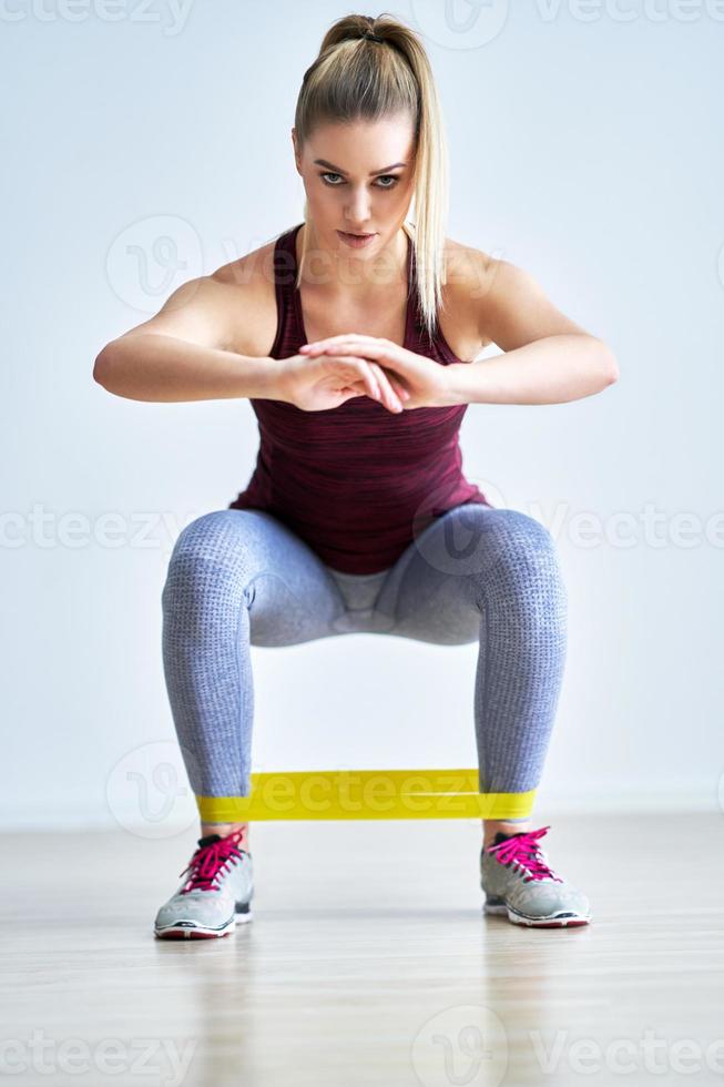 Adult woman training alone at home photo