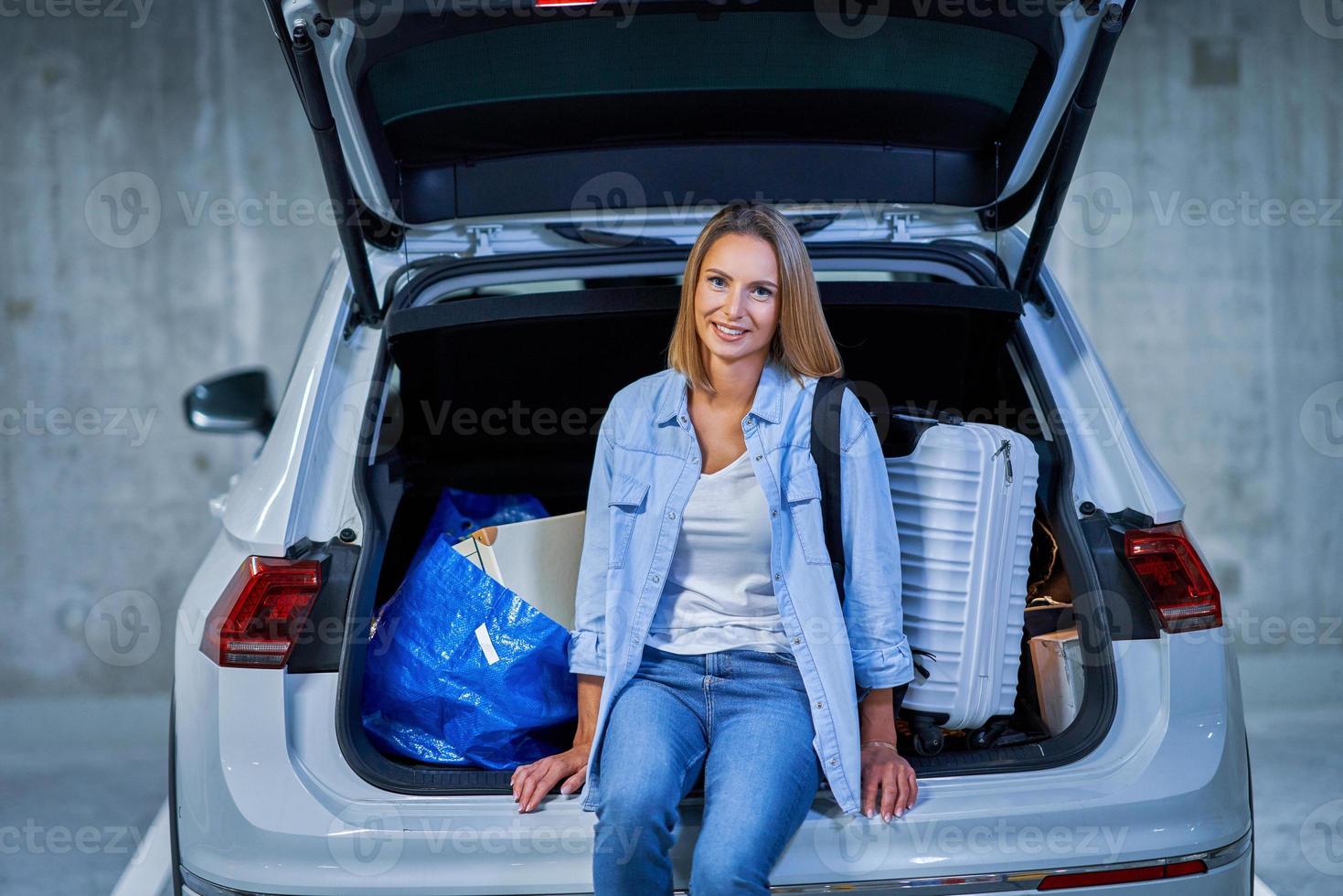 Adult woman tourist in underground airport parking lot photo