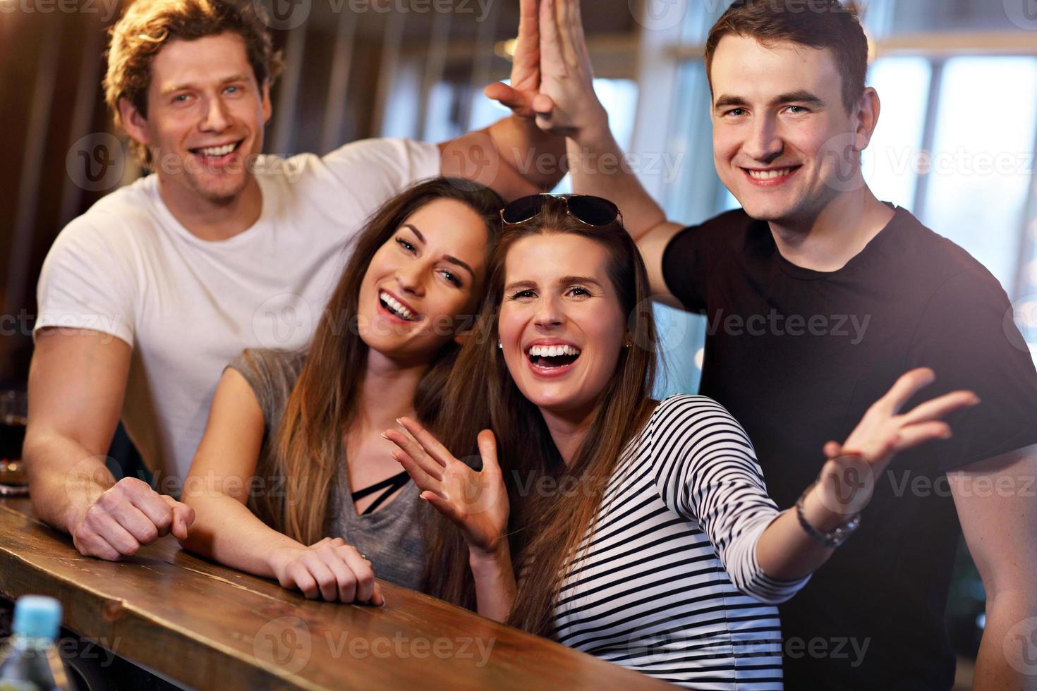 Group Of Friends Enjoying Meal In Restaurant photo
