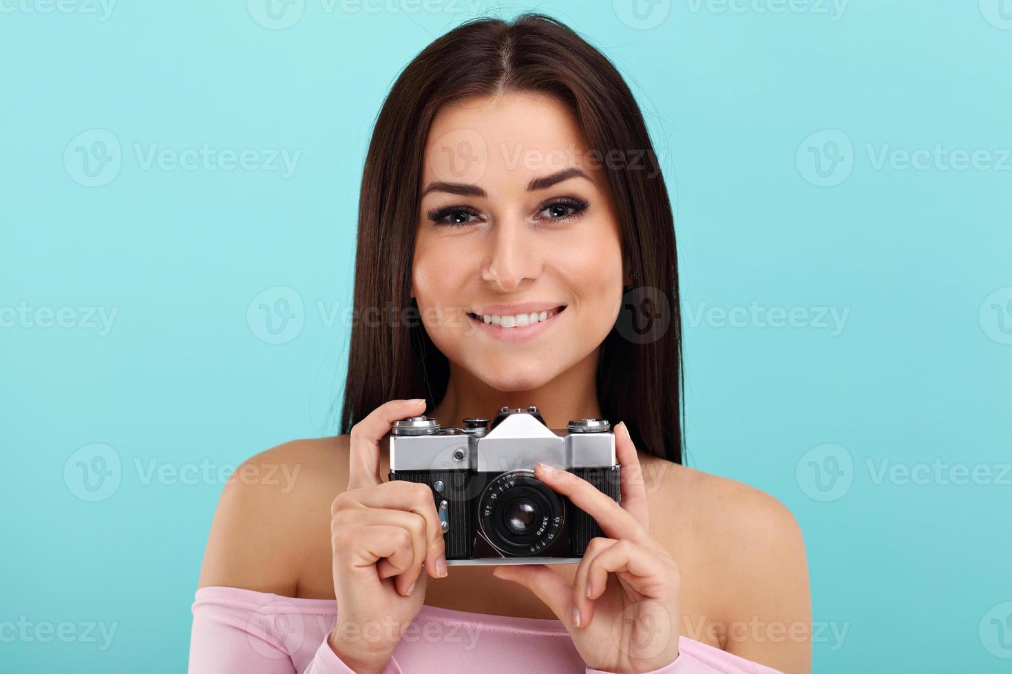 Woman against blue wall background photo