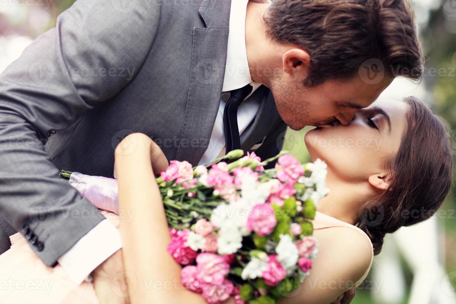 Beautiful wedding couple enjoying wedding photo