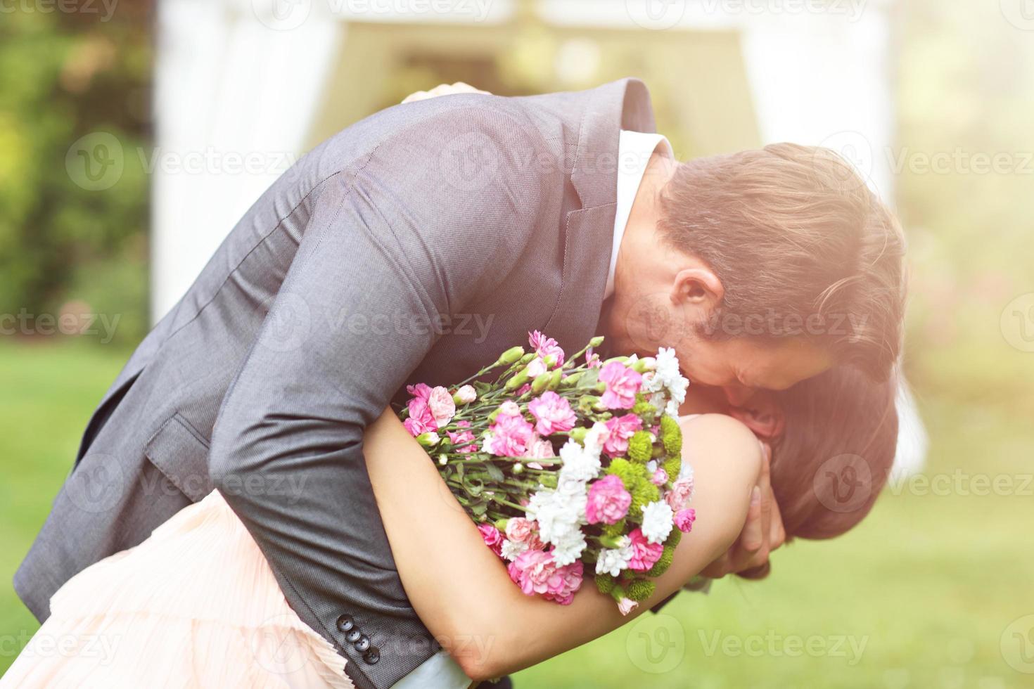 Beautiful wedding couple enjoying wedding photo