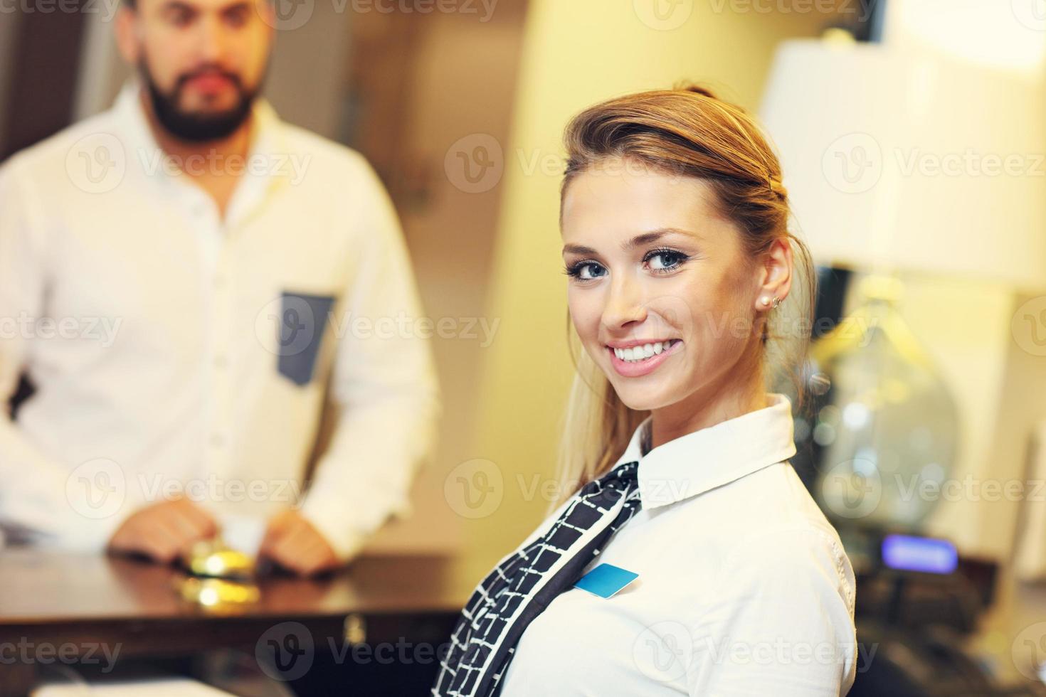 Pretty receptionist smiling photo