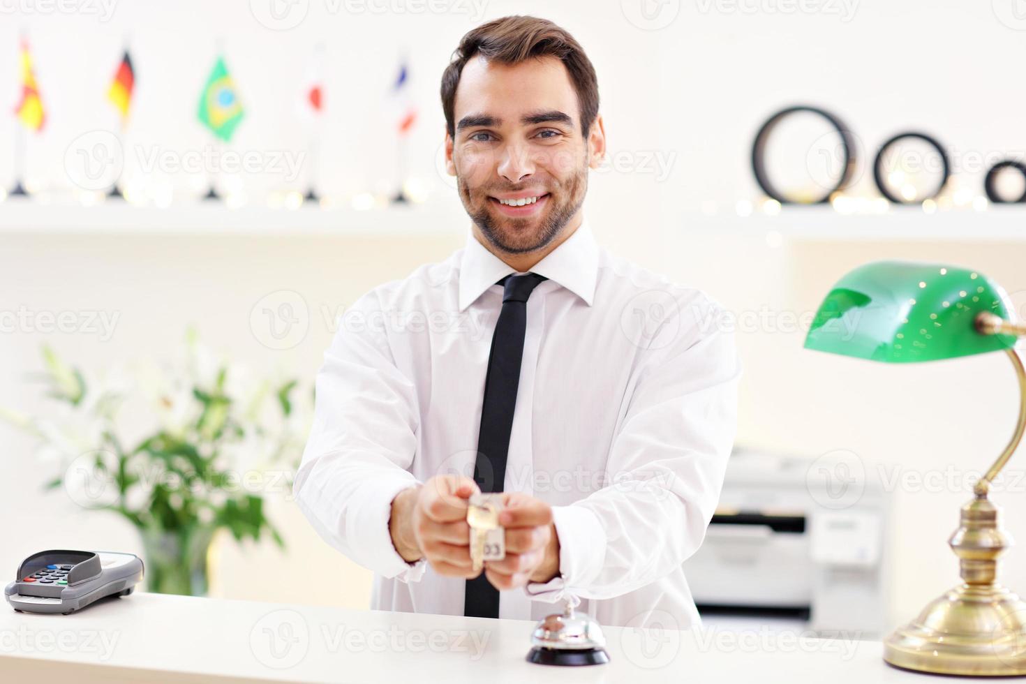 Male receptionist smiling photo