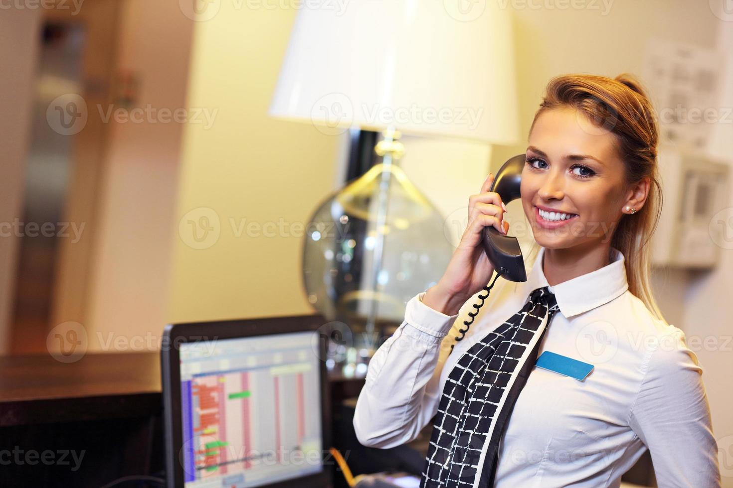 Pretty receptionist smiling photo