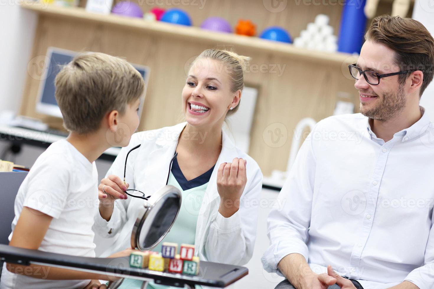 Cute little boy at speech therapist office photo