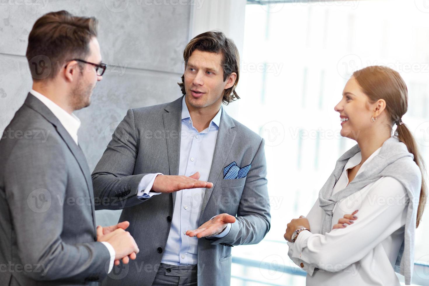 Group of business people sharing their ideas photo