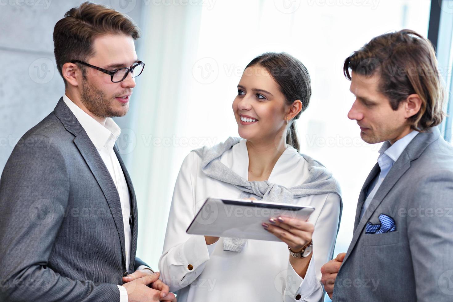 Group of business people sharing their ideas photo