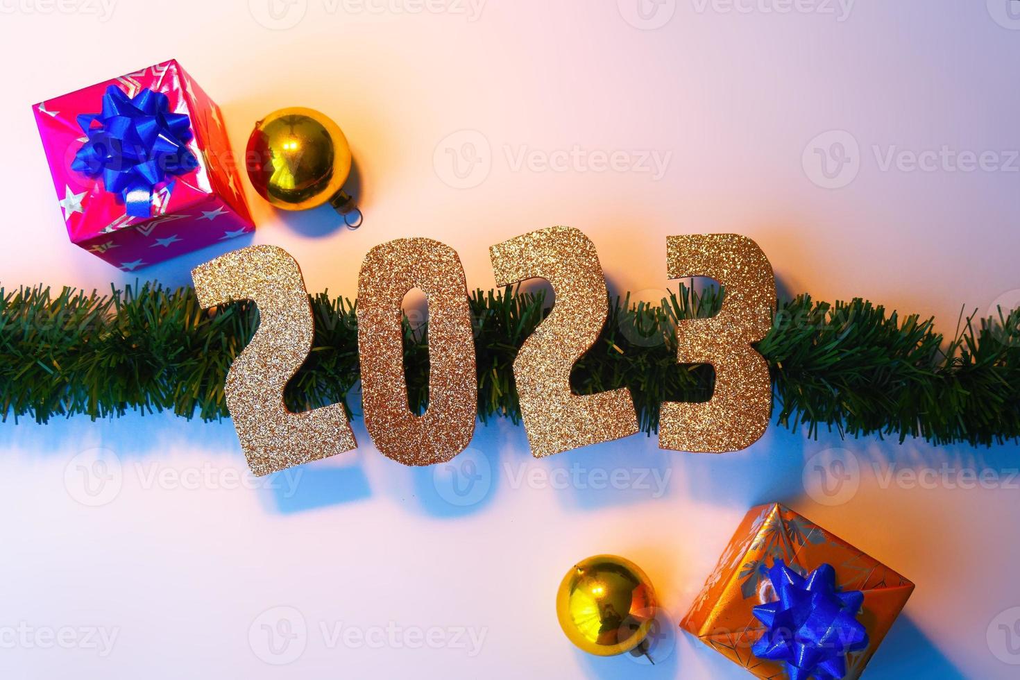 Happy New Year 2023. Golden numbers Christmas white background photo