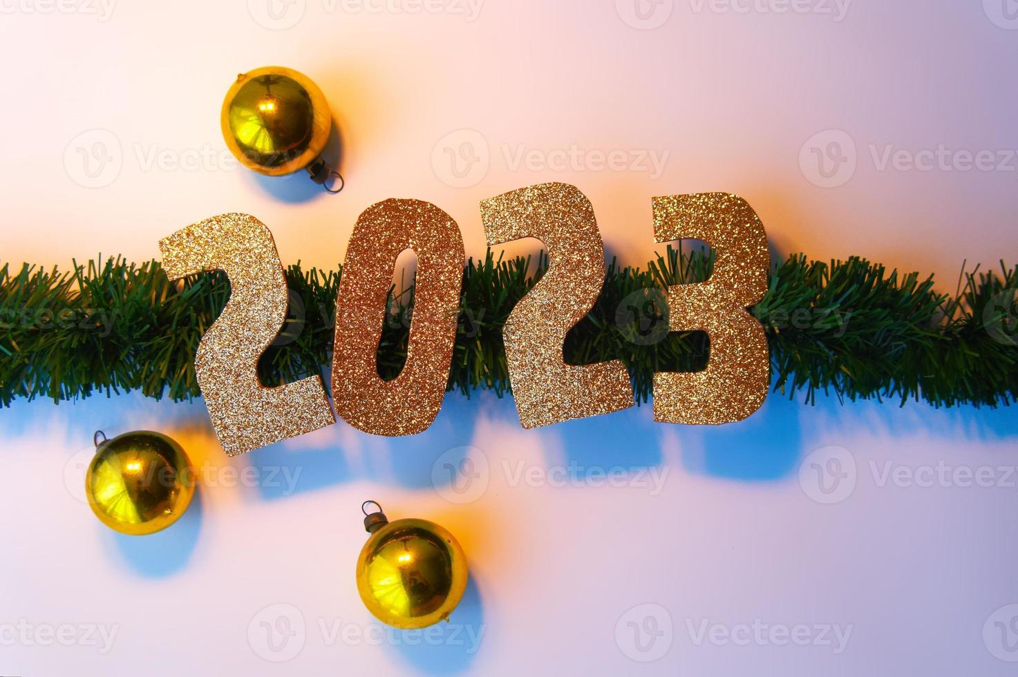 Happy New Year 2023. Golden numbers Christmas white background photo