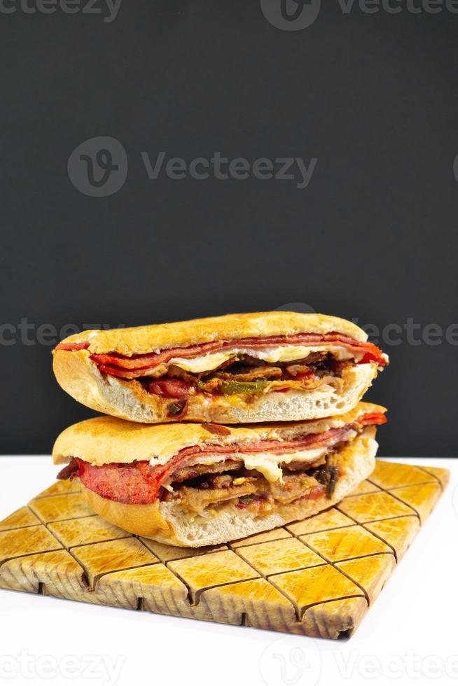 Mexican Torta Caprichosa Grande with Milanese pork, leg ham and cheese photo