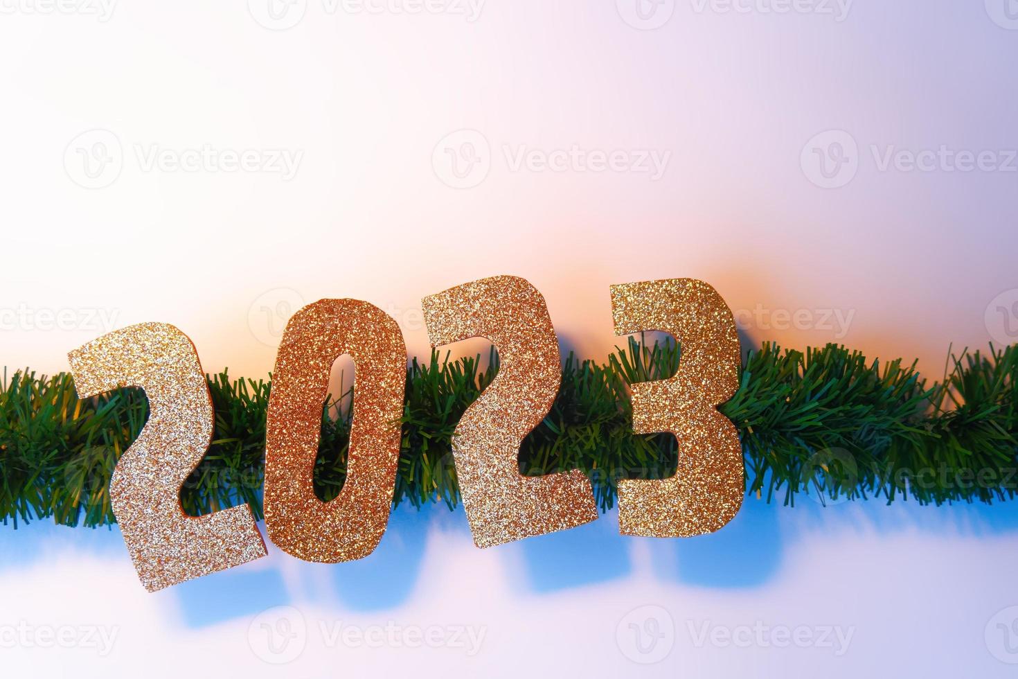 Happy New Year 2023. Golden numbers Christmas white background photo