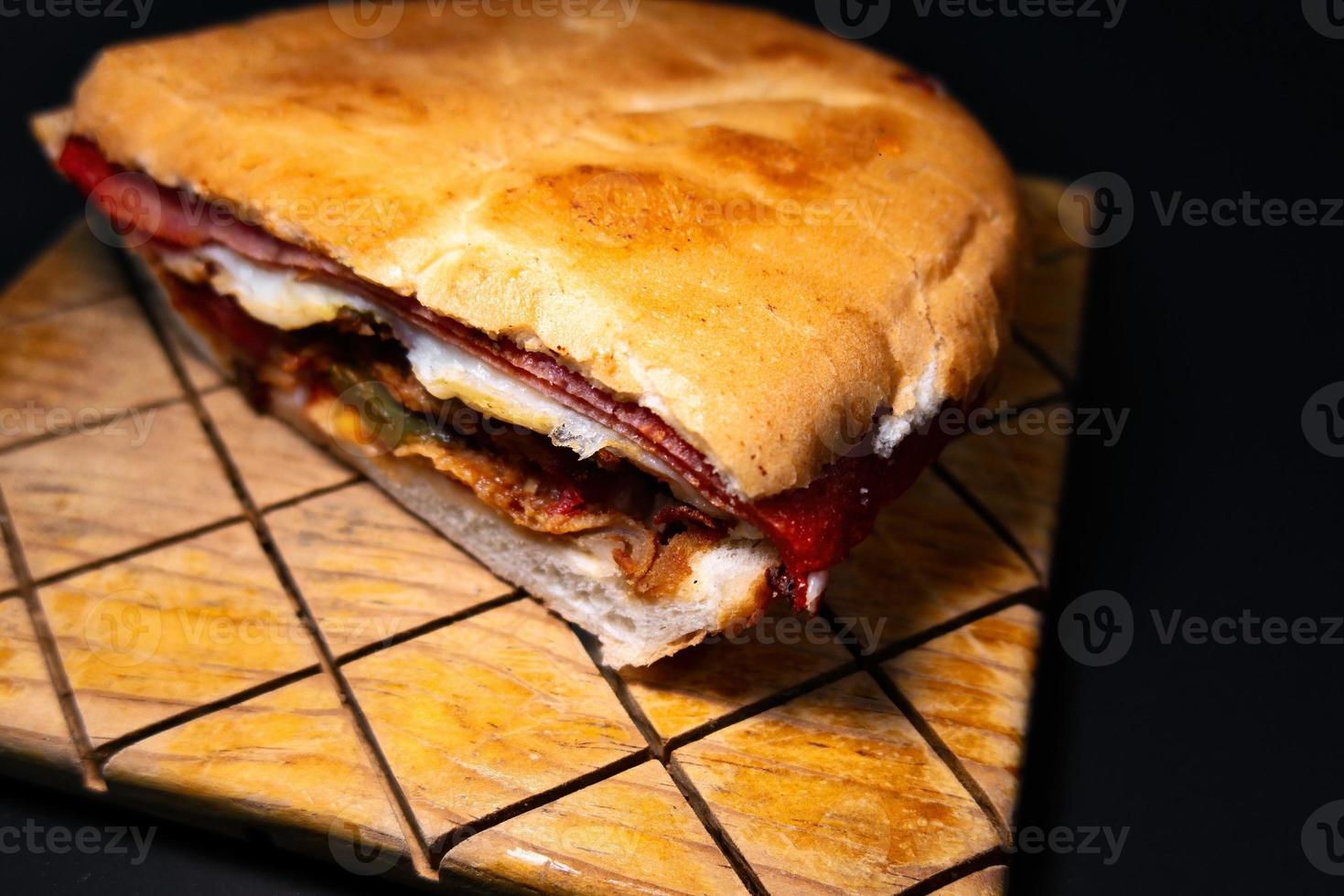 Mexican Torta Caprichosa Grande with Milanese pork, leg ham and cheese photo