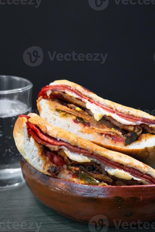 Mexican Torta Caprichosa Grande with Milanese pork, leg ham and cheese photo