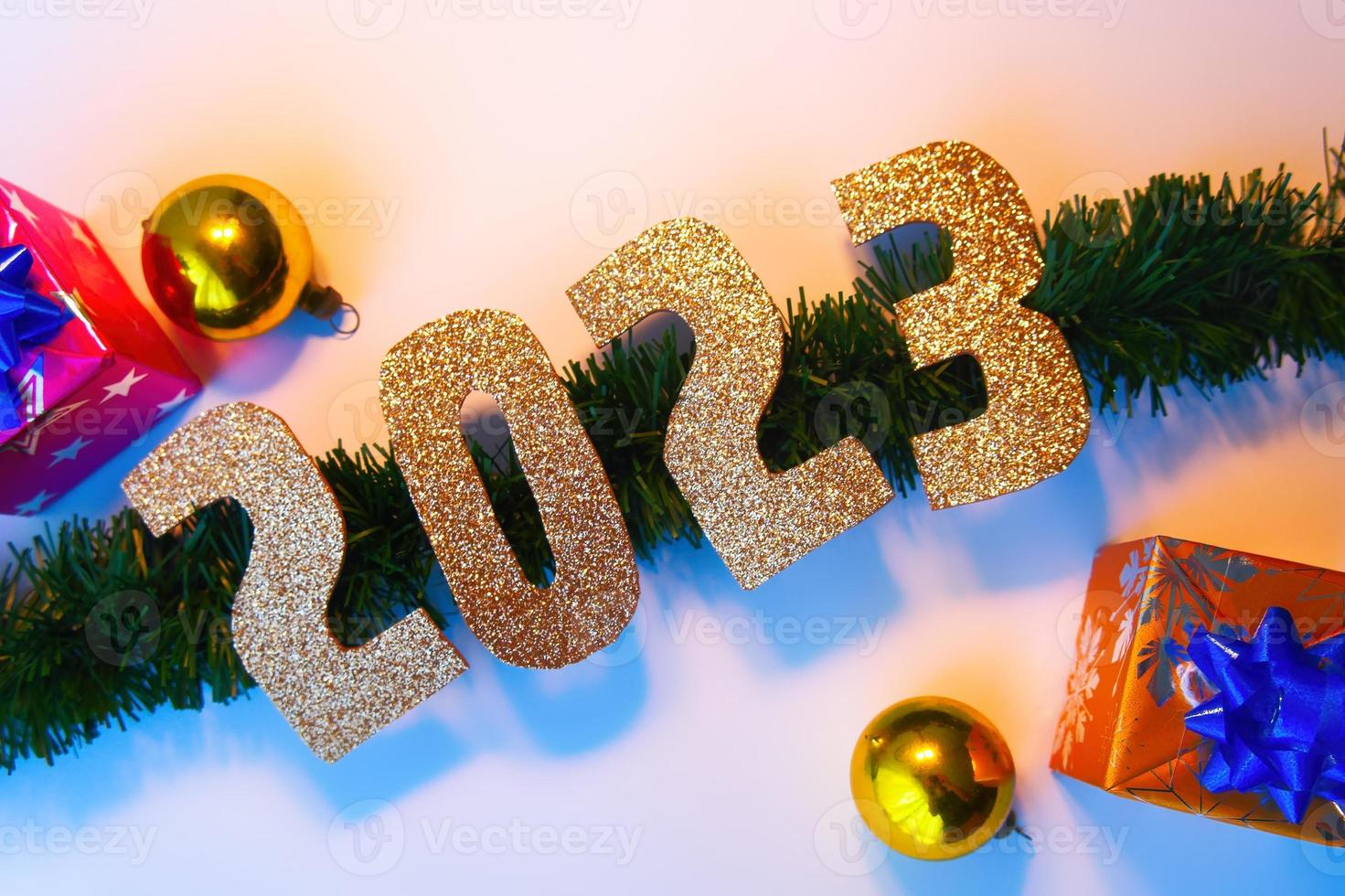 Happy New Year 2023. Golden numbers Christmas white background photo