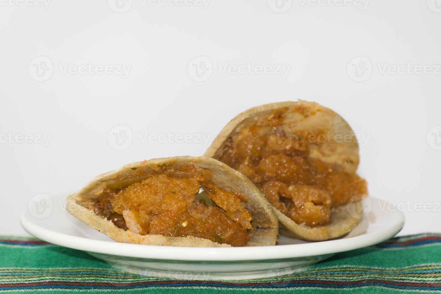 Mexican gorditas de migajas with pork rinds and chile photo