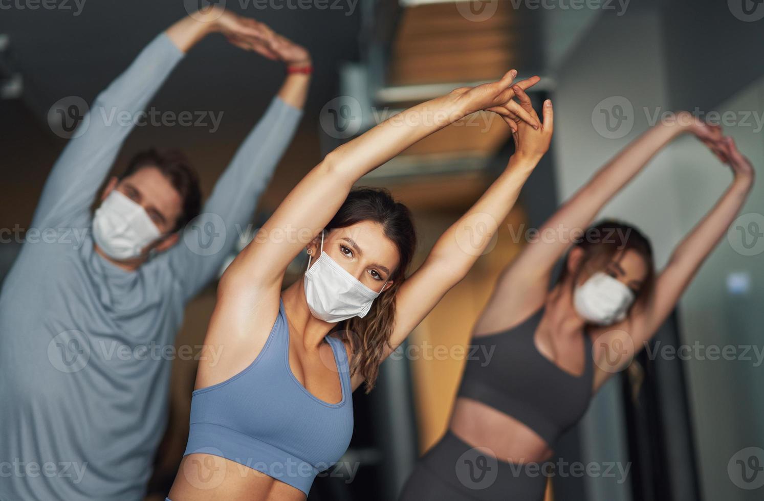 Group of people wearing masks working out in a gym 15866682 Stock Photo