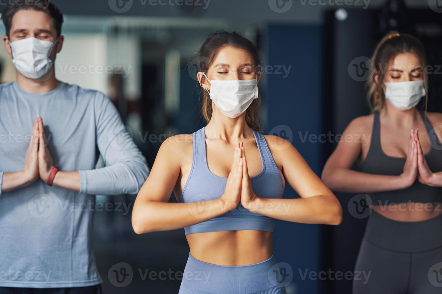 Group of people wearing masks working out in a gym 15866683 Stock Photo