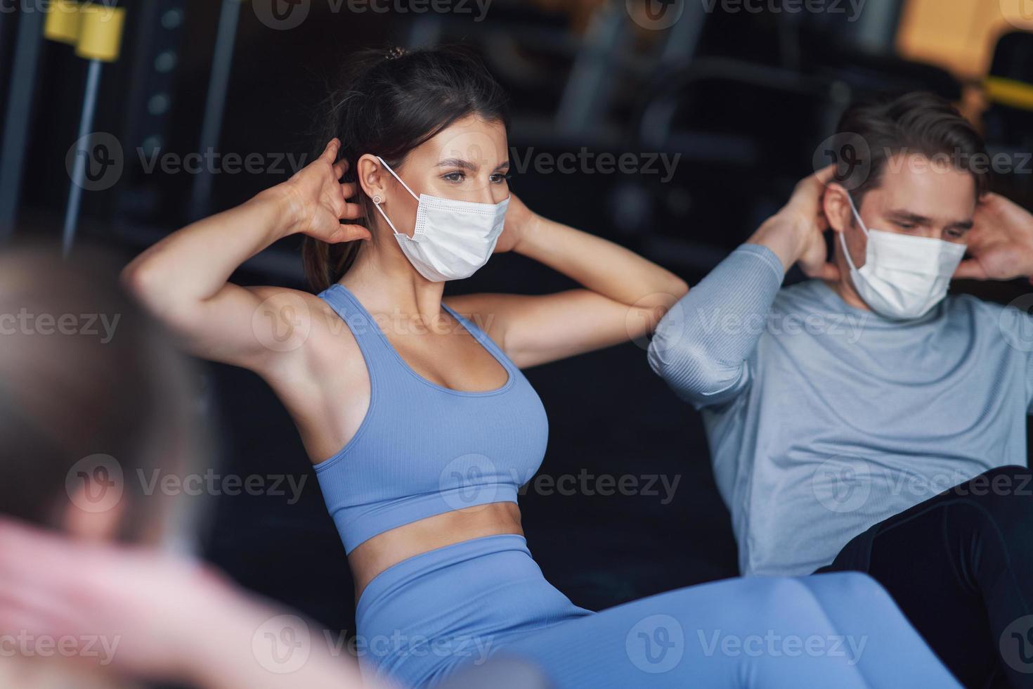 Group of people wearing masks working out in a gym 15866698 Stock Photo