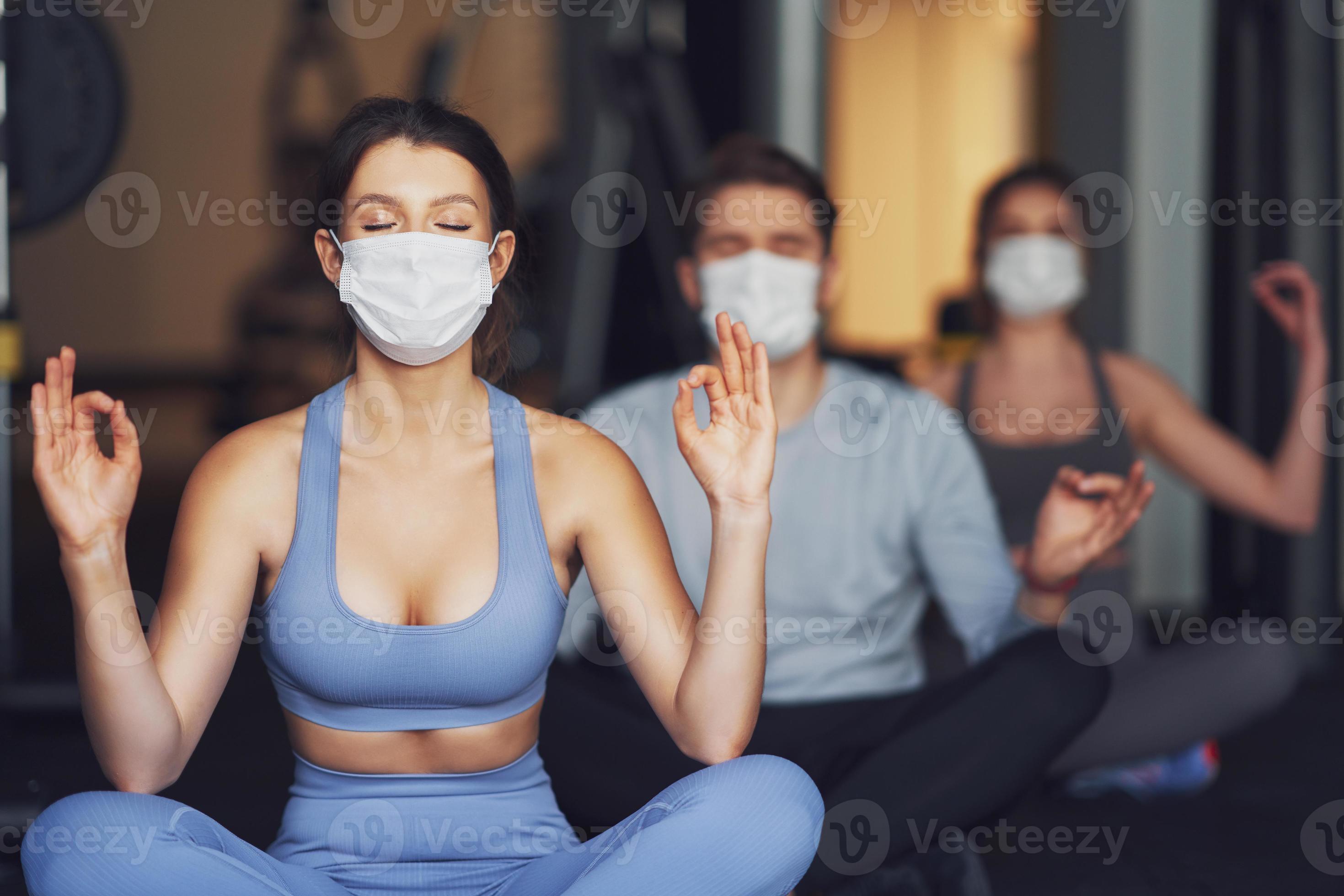 Group of people wearing masks working out in a gym 15866703 Stock Photo