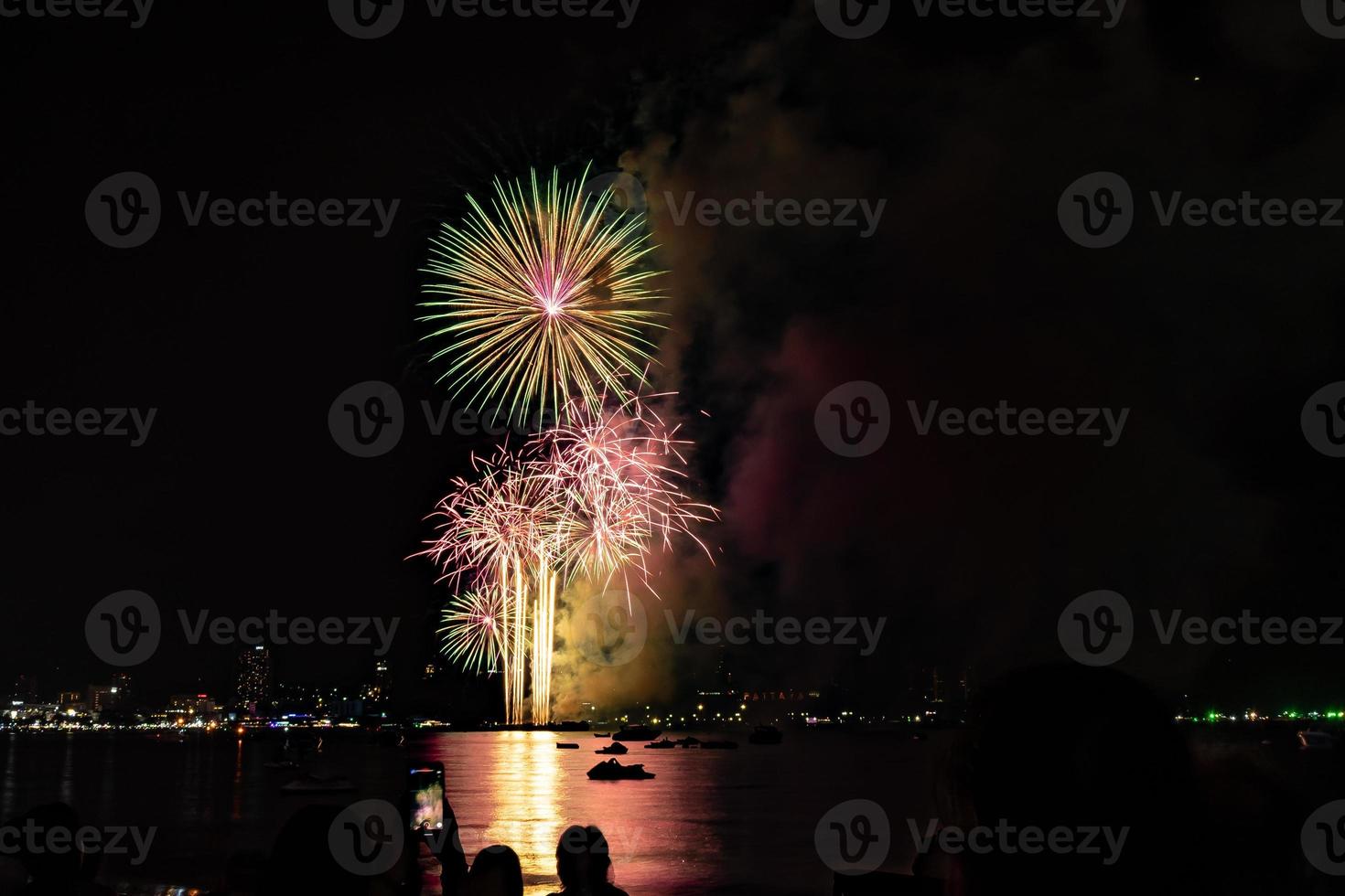 Abstract colored firework background light up the sky with dazzling display photo