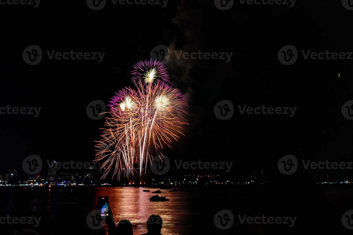 Abstract colored firework background light up the sky with dazzling display photo