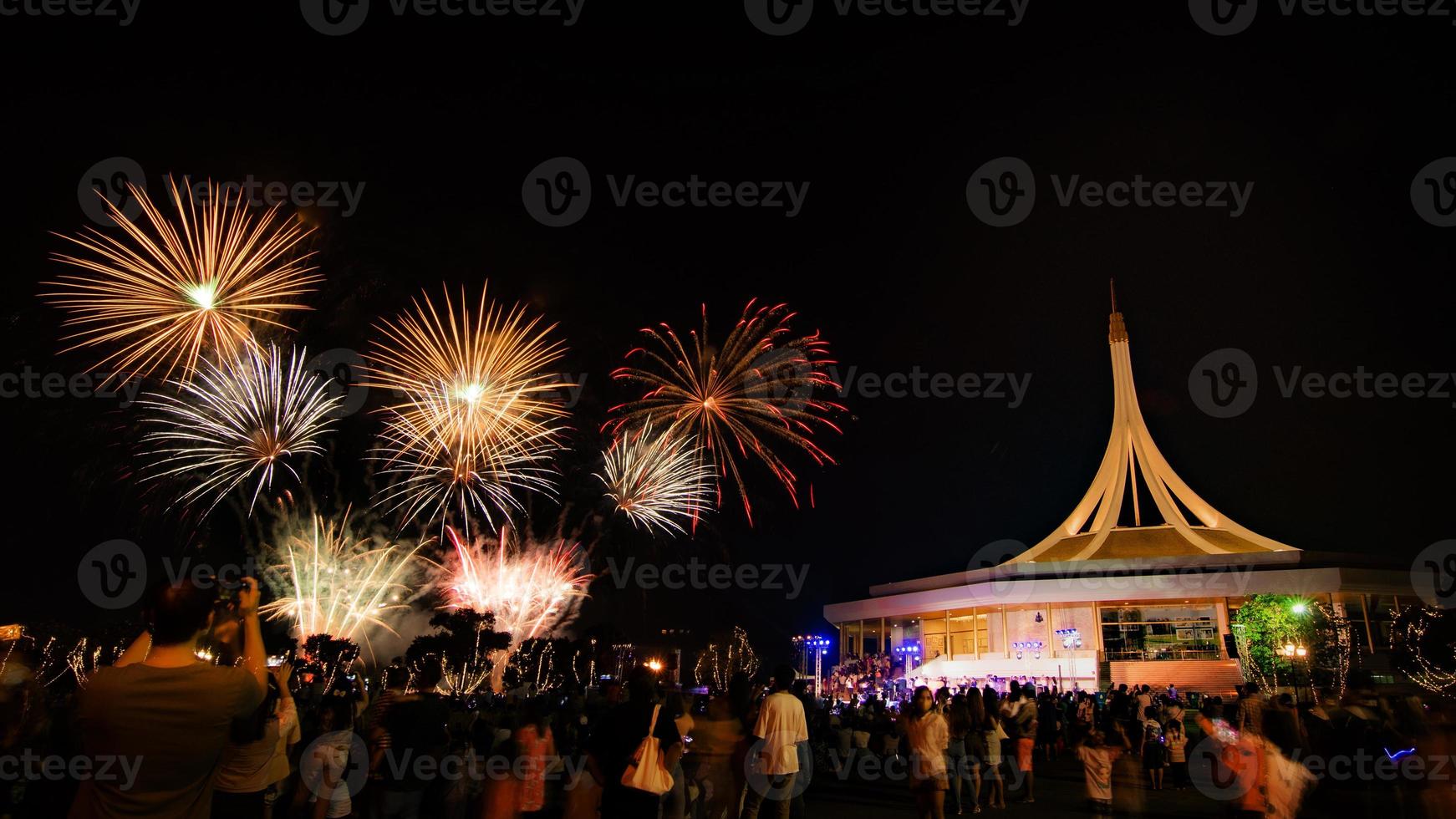 Beautiful Fireworks at the park and people looking at the fireworks photo