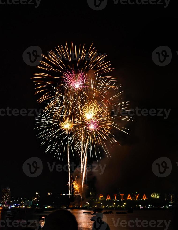 Abstract colored firework background light up the sky with dazzling display photo