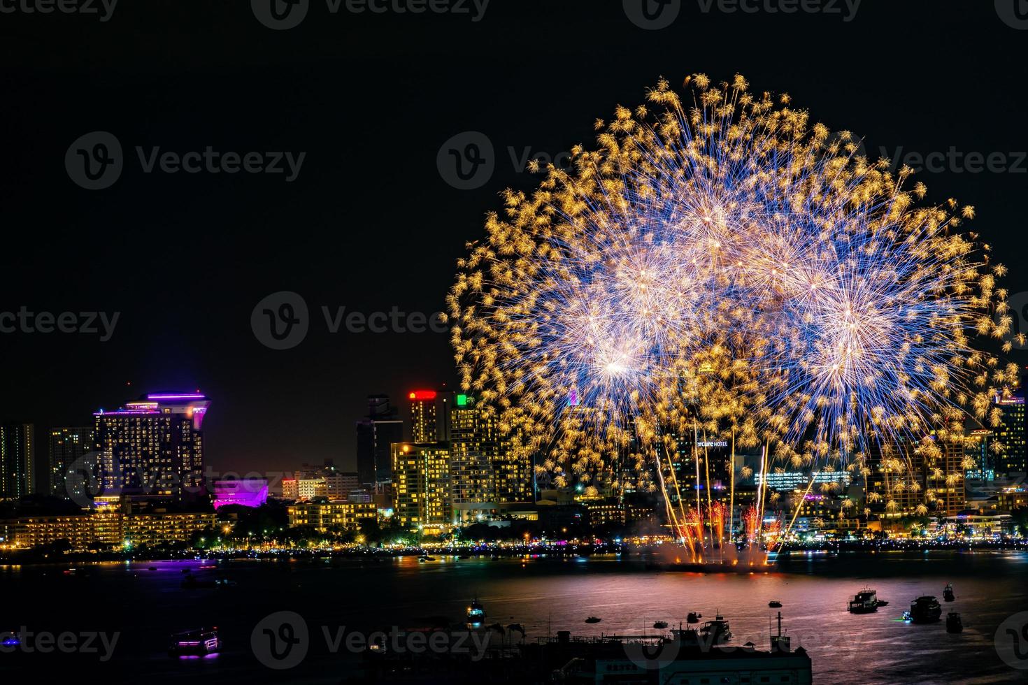 Abstract colored firework background light up the sky with dazzling display photo