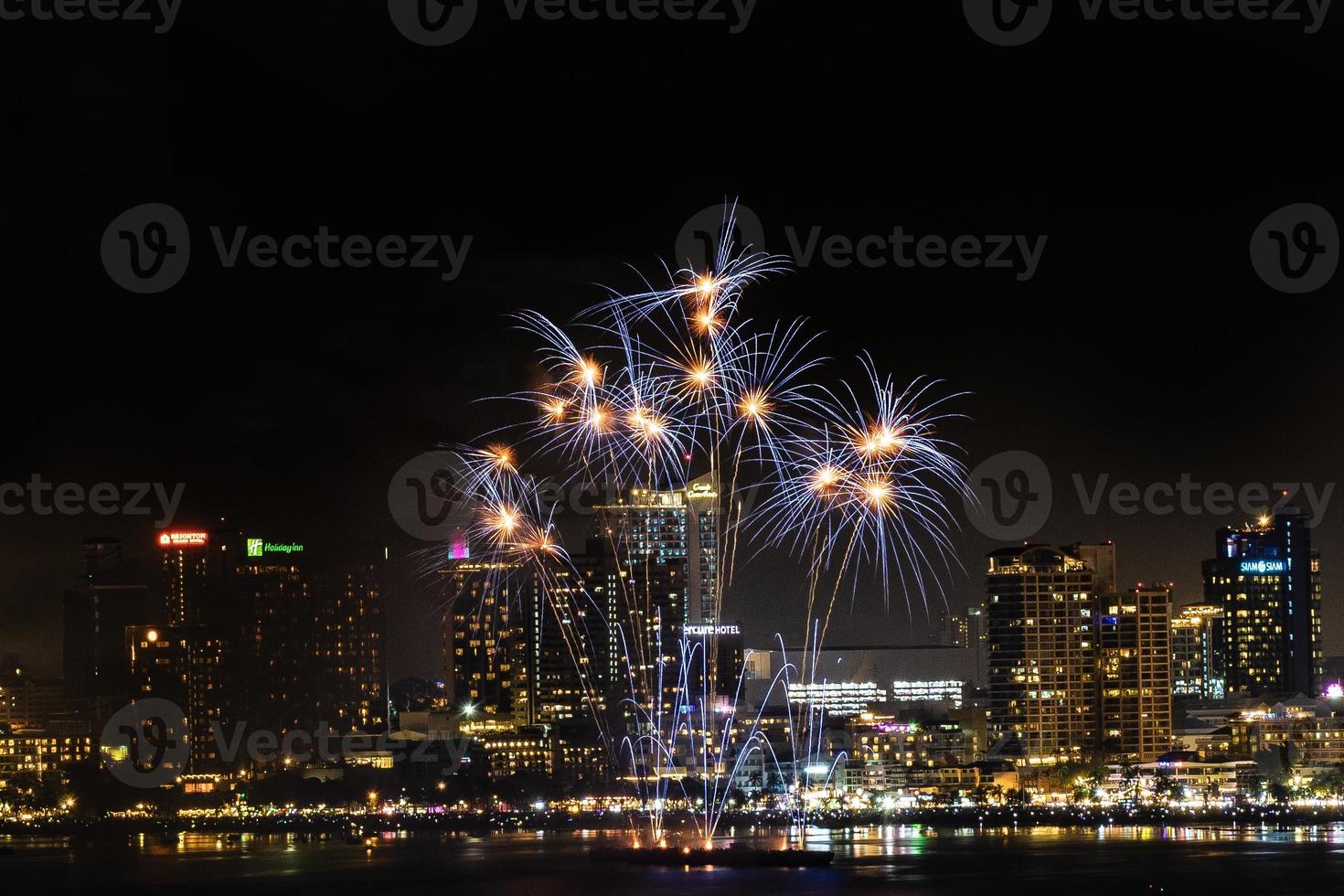 Abstract colored firework background light up the sky with dazzling display photo