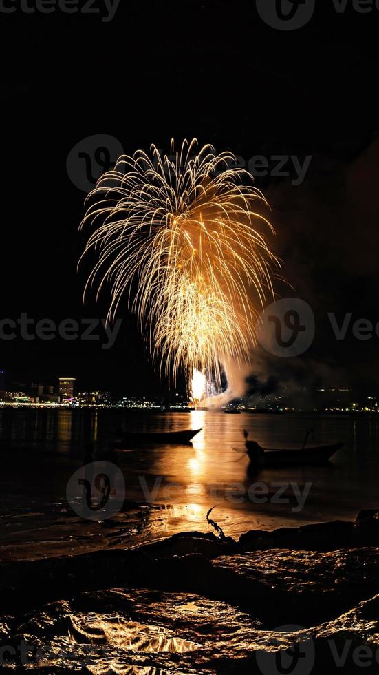 Abstract colored firework background light up the sky with dazzling display photo