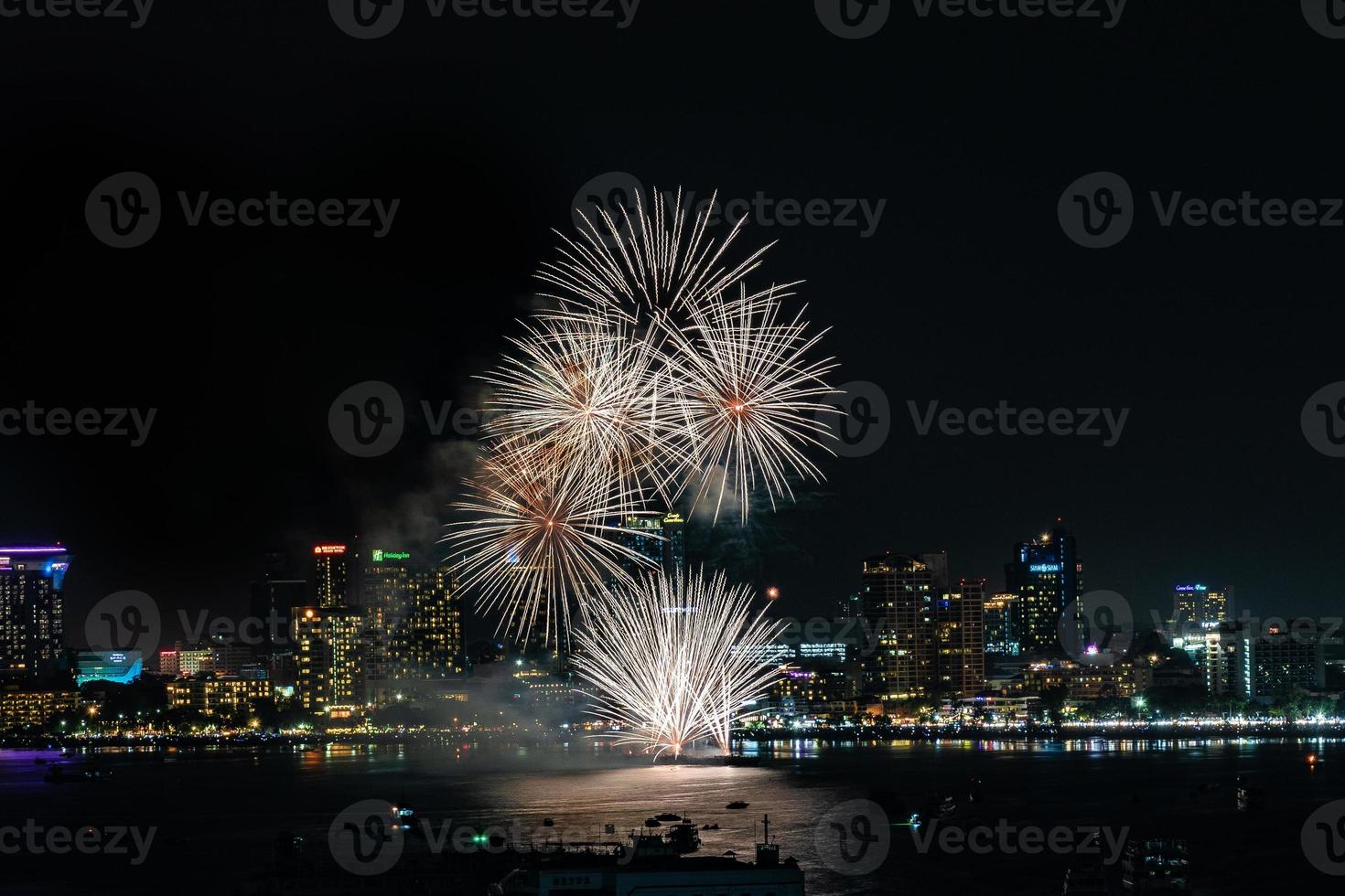 Abstract colored firework background light up the sky with dazzling display photo