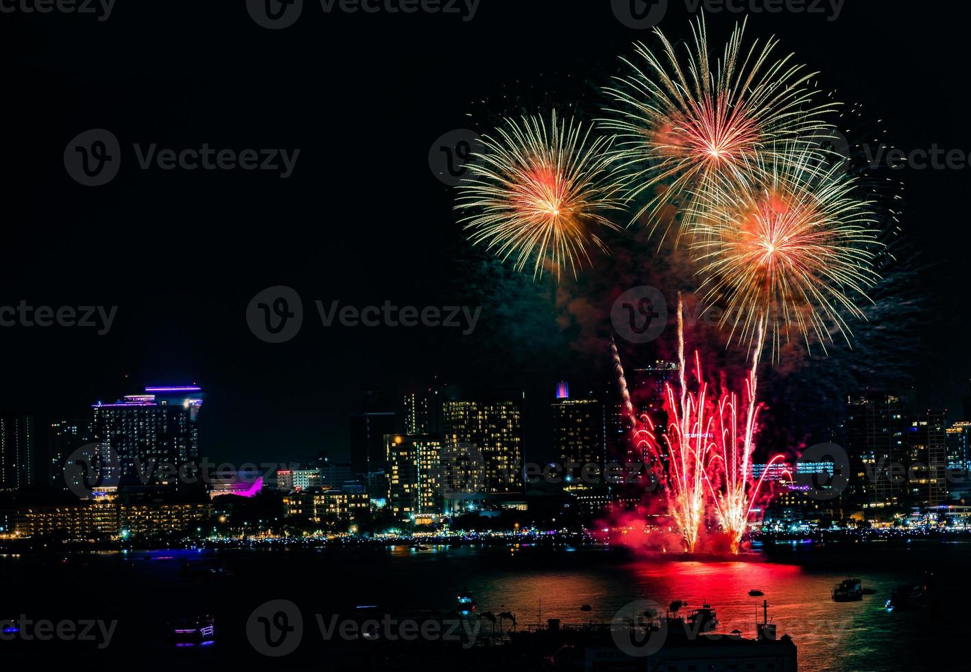 Abstract colored firework background light up the sky with dazzling display photo