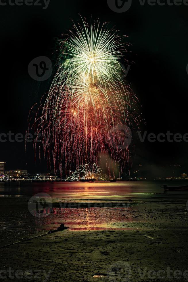 Abstract colored firework background light up the sky with dazzling display photo