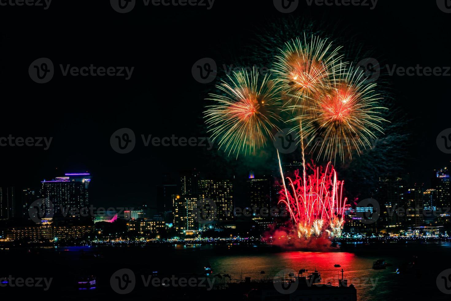 Abstract colored firework background light up the sky with dazzling display photo