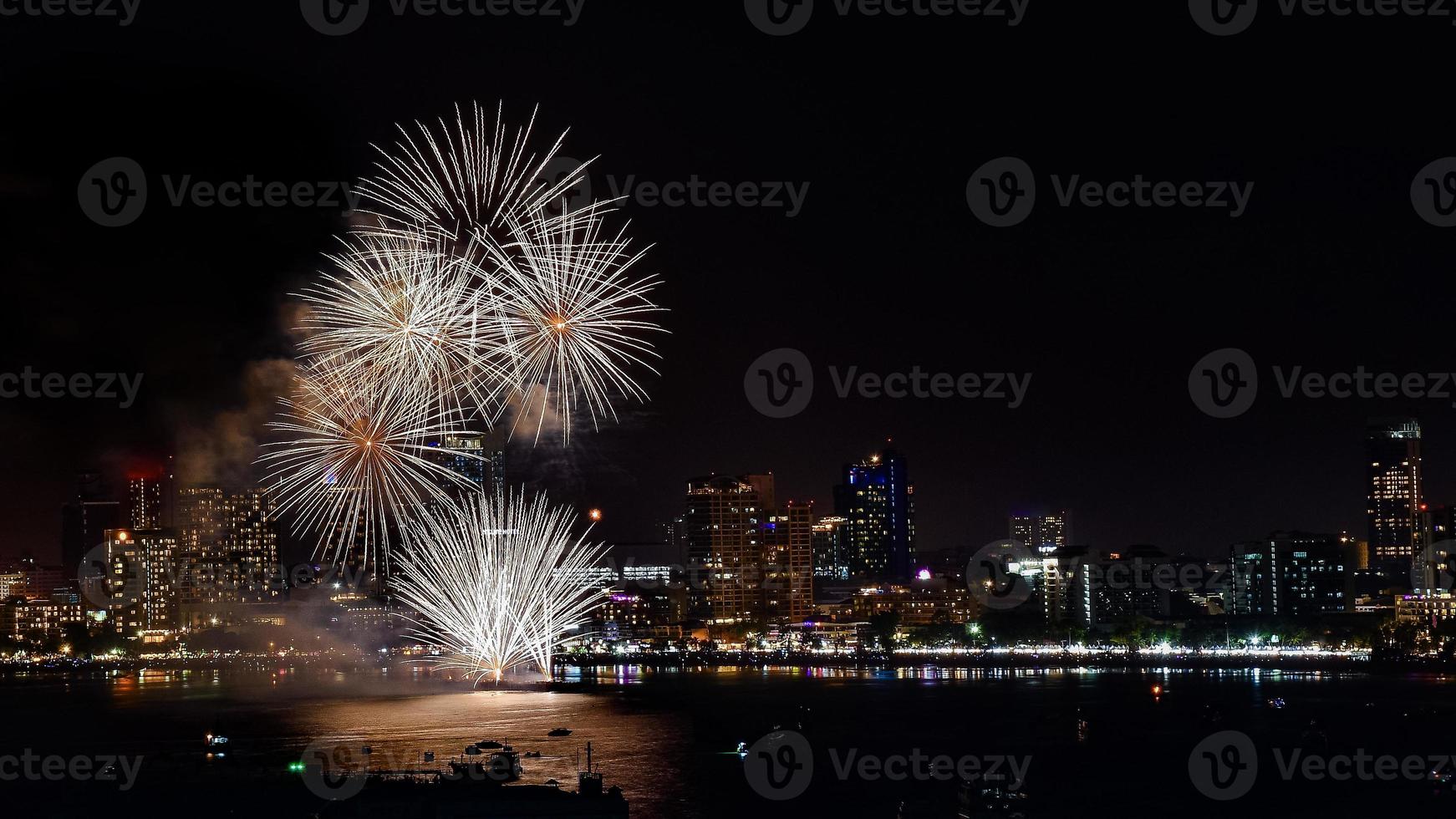 Abstract colored firework background light up the sky with dazzling display photo