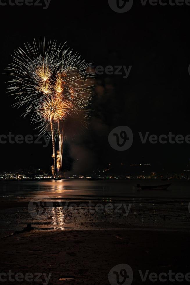 Abstract colored firework background light up the sky with dazzling display photo