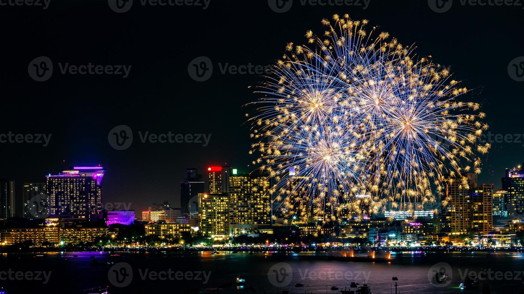 Abstract colored firework background light up the sky with dazzling display photo