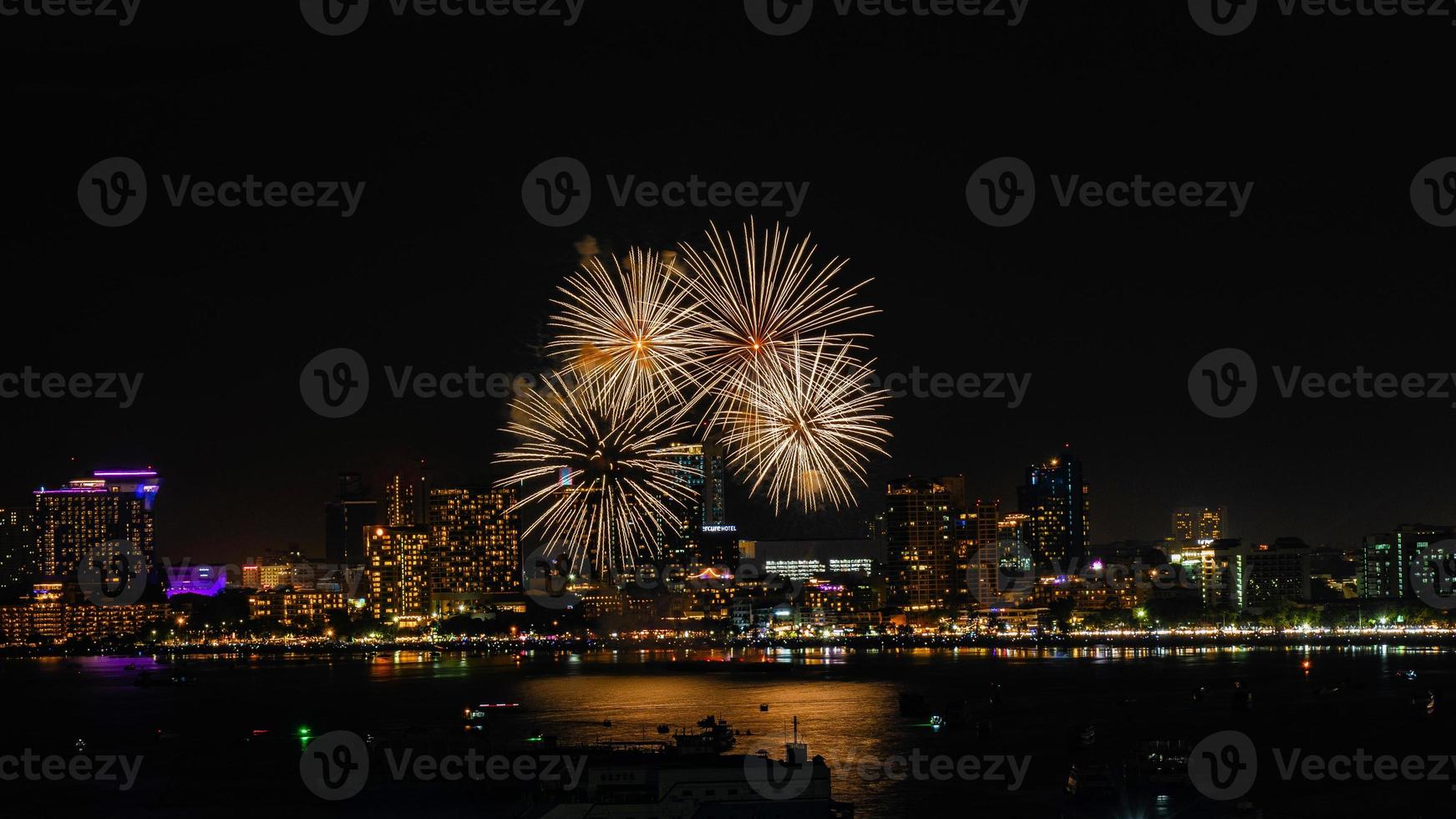 Abstract colored firework background light up the sky with dazzling display photo
