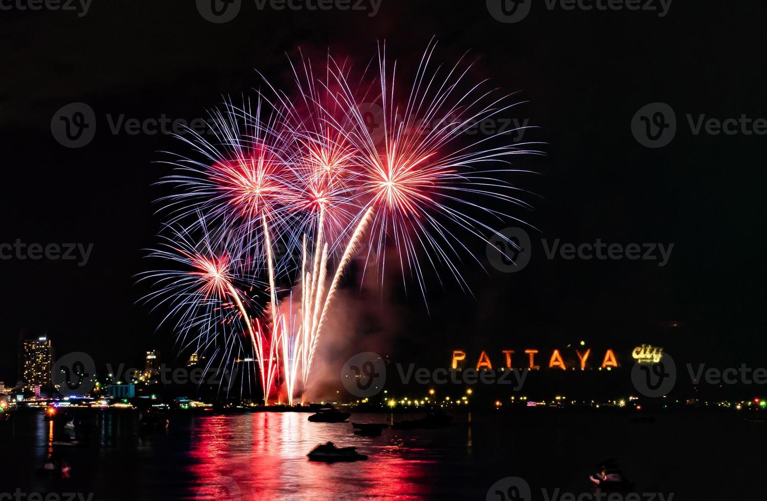 Abstract colored firework background light up the sky with dazzling display photo