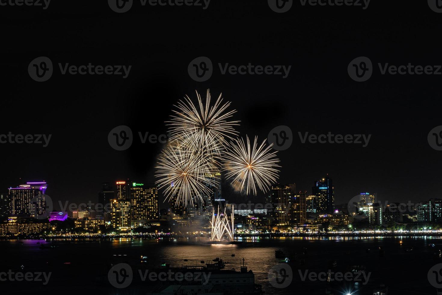 Abstract colored firework background light up the sky with dazzling display photo