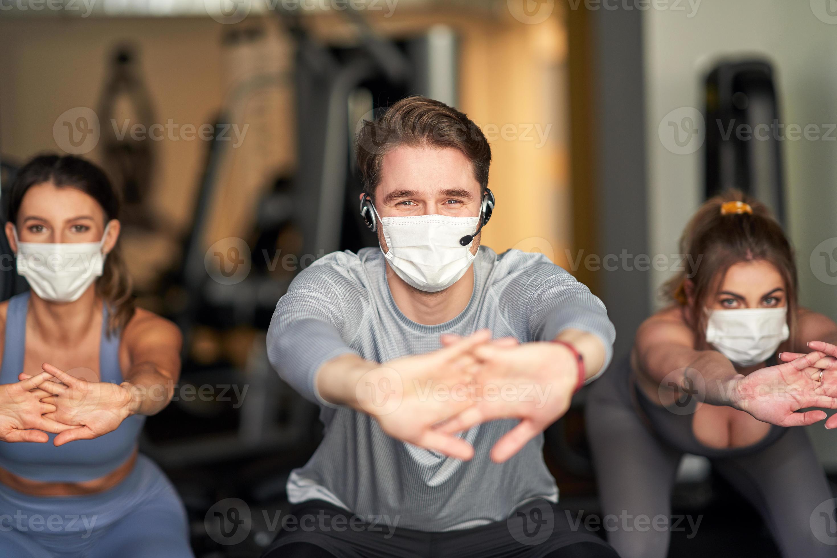 Group of people wearing masks working out in a gym 15867465 Stock Photo