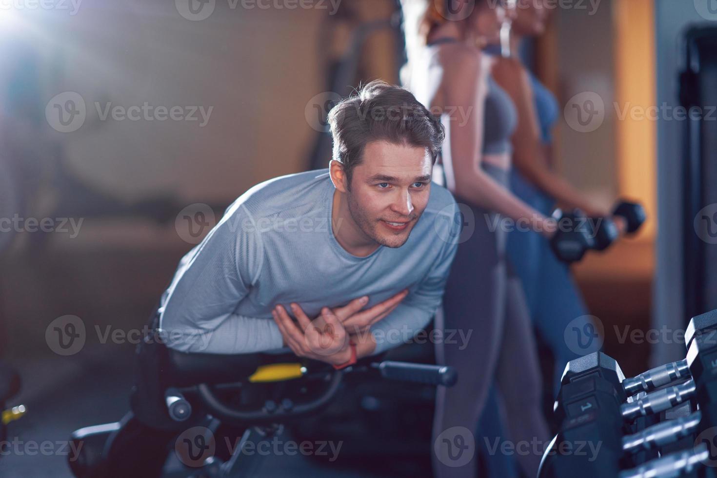 Group of people working out in a gym photo
