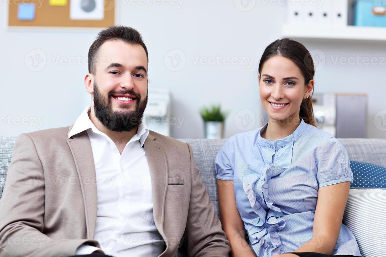 Businesspeople working together in office photo