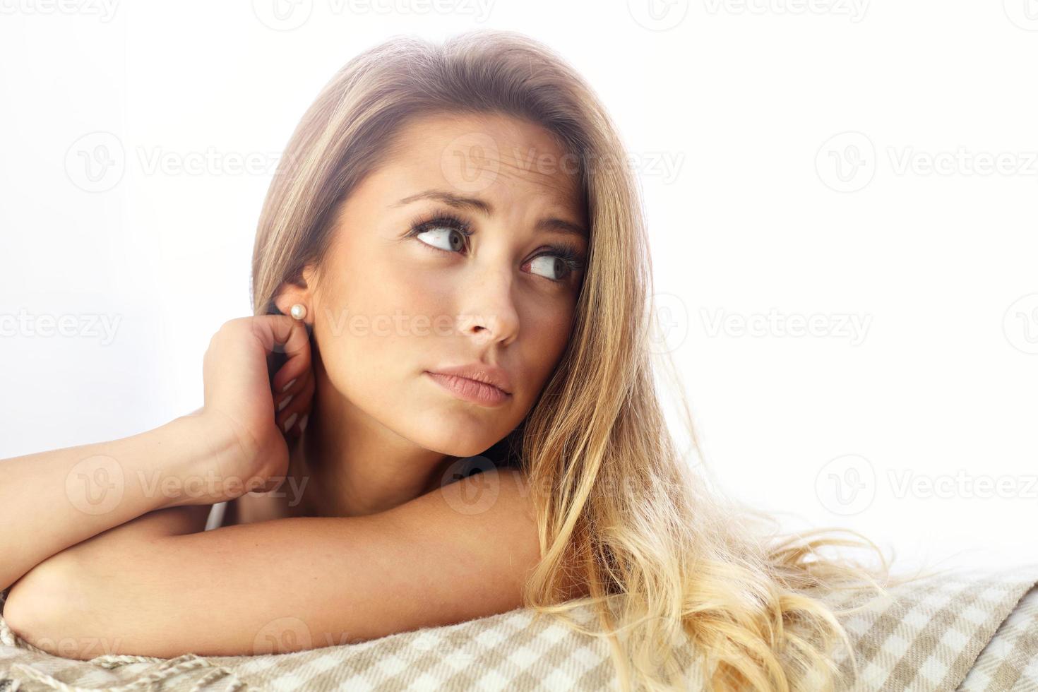 Sad woman resting on sofa photo